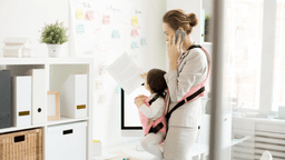 woman on the phone working with a baby